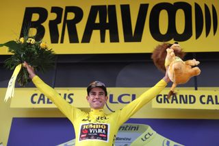 JumboVisma teams Belgian rider Wout Van Aert celebrates on the podium after winning the 4th stage of the 109th edition of the Tour de France cycling race 1715 km between Dunkirk and Calais in northern France on July 5 2022 Photo by Thomas SAMSON AFP Photo by THOMAS SAMSONAFP via Getty Images