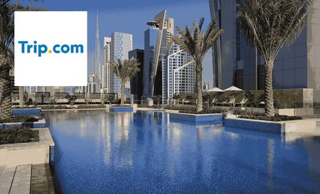 Trip.com logo top left with an image of a hotel pool in a city 