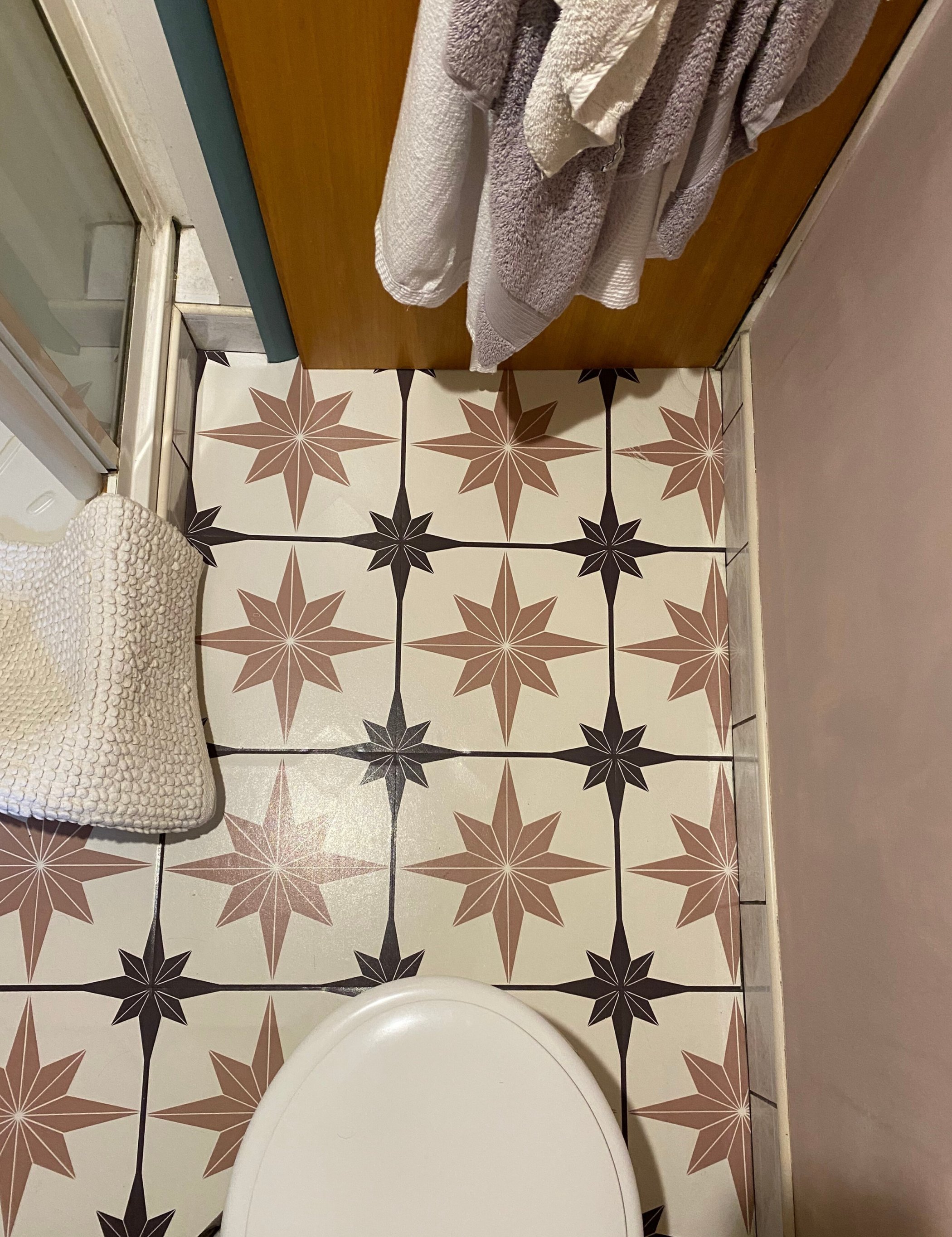 A bathroom floor with Moroccan-inspired vinyl floor tiles