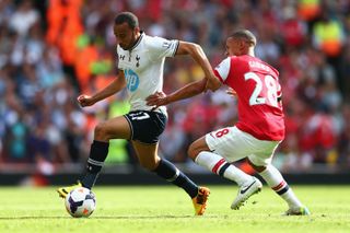 Tottenham's Andros Townsend is tracked by Arsenal's Kieran Gibbs in a Premier League game in September 2013.