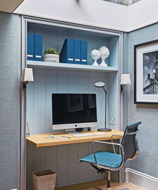blue home office with desk, chair and computer