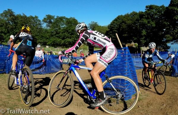 Riders make their way through a series of turns before the barriers