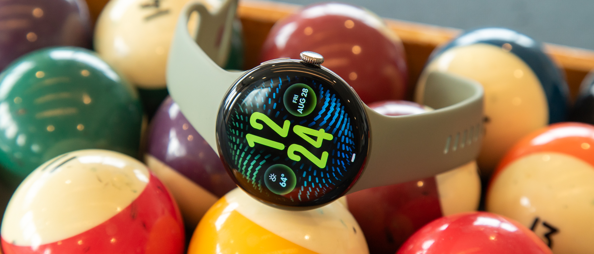 The Pixel Watch 5 on a stack of billiard balls