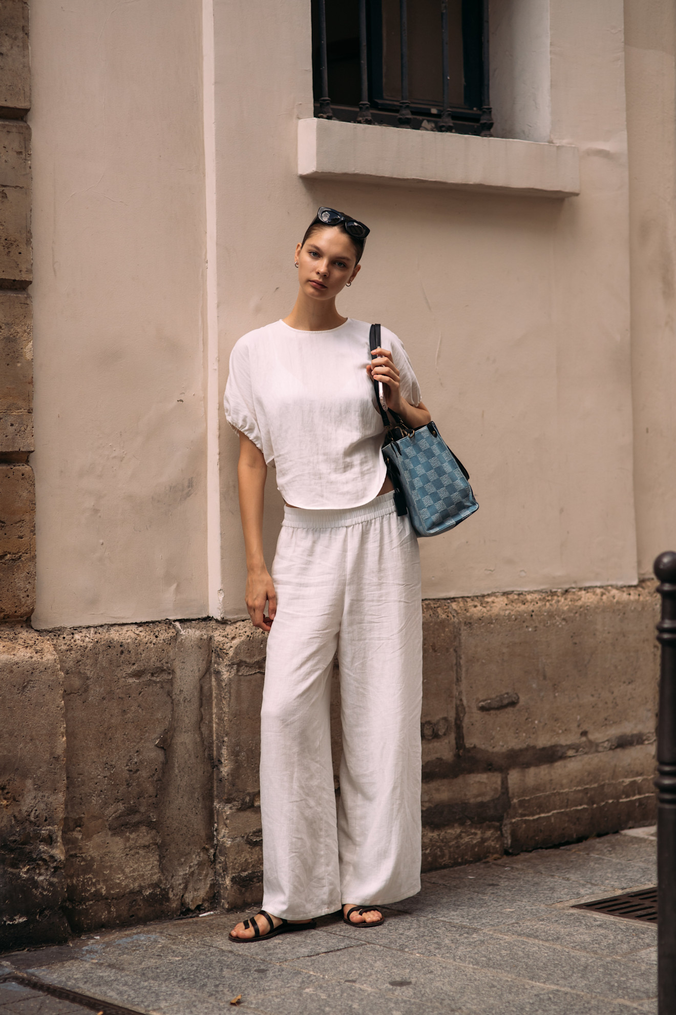 fashion week attendee wearing white linen set