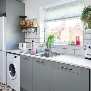 kitchen makeover with grey units and white worktop and sink