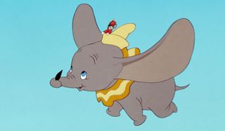 Dumbo flying with black feather