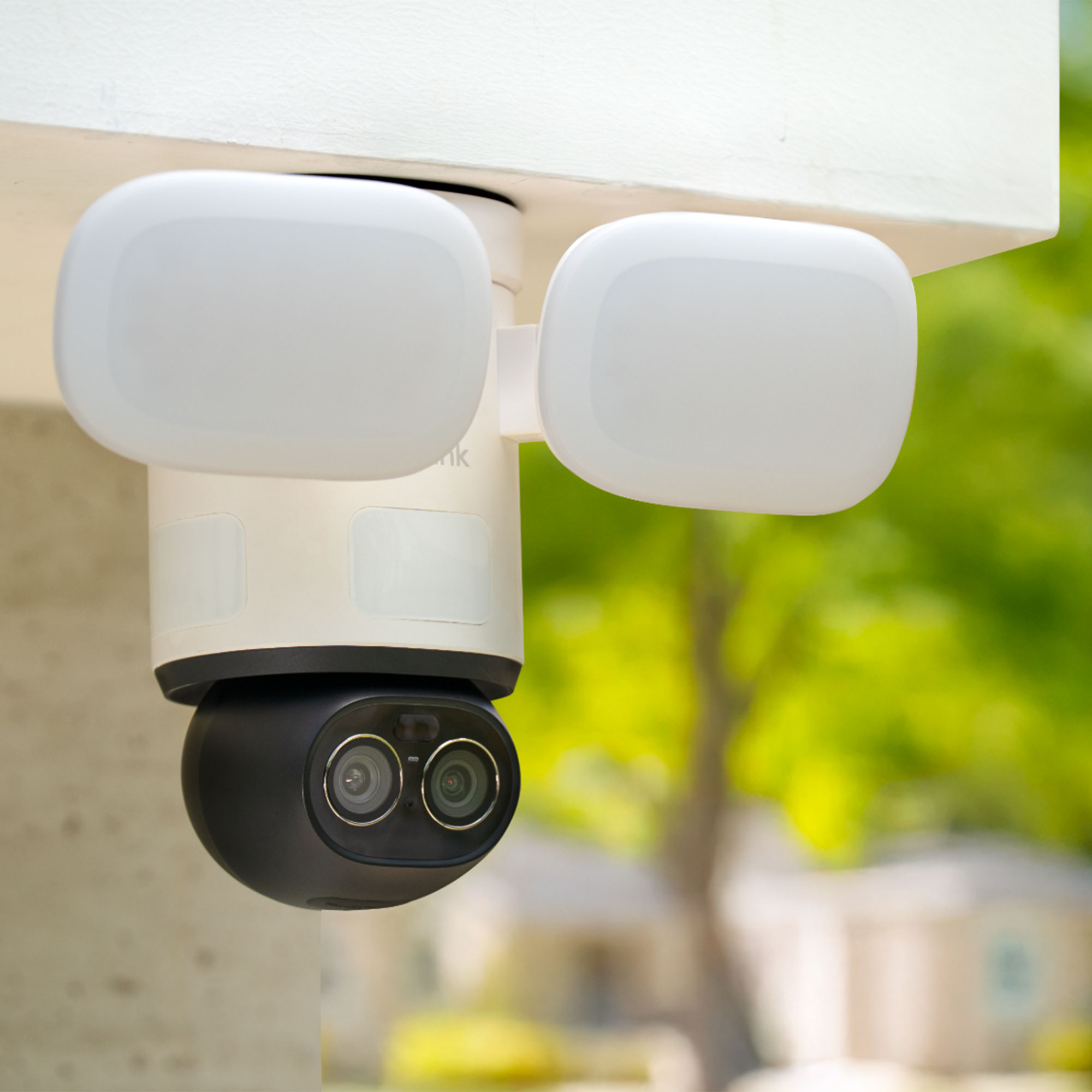 Reolink floodlight security camera below roof on building