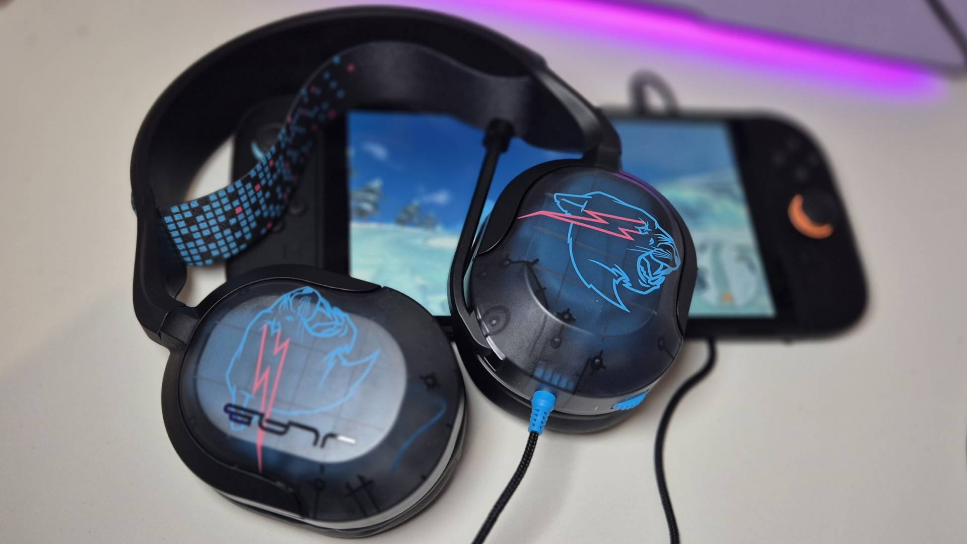 Photo of the JLab Gaming x MrBeast Nightfall wired gaming headset taken by Rosalie Newcombe, sitting on a Nintendo Switch 2.