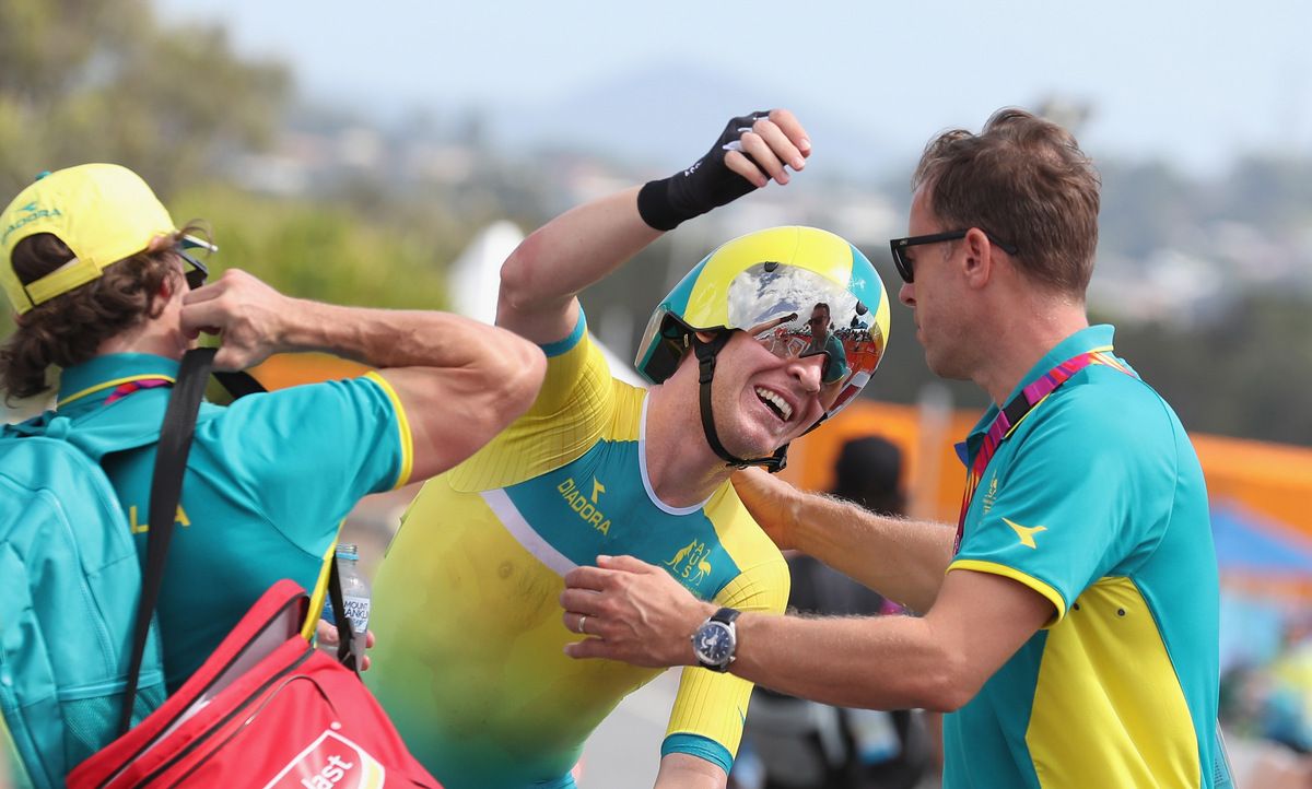 Cameron Meyer (Australia) reaches for HP director Simon Jones after winning gold