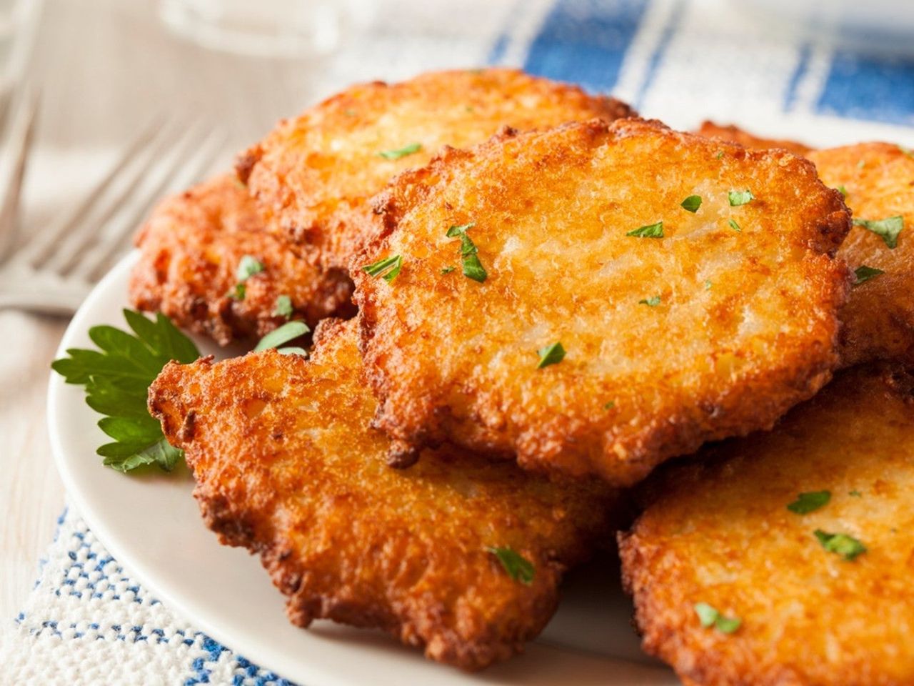 Close up of several latkes on a plate