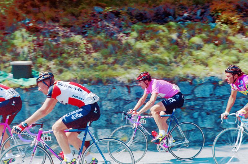 Giani Bugno in the maglia rosa during the 1990 Giro d'Italia as the peloton makes its way up the Mortirolo