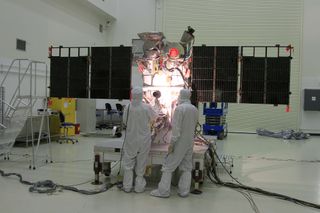 Engineers conduct solar array tests on the Deep Space Climate Observatory satellite ahead of its Feb. 8, 2015 launch on a SpaceX Falcon 9 rocket.