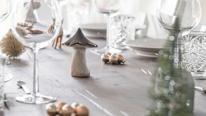 A small mushroom ornament on a dining table