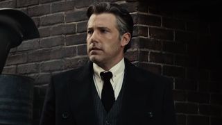 Ben Affleck looks to the side with disbelief in Zack Snyder's Justice League.