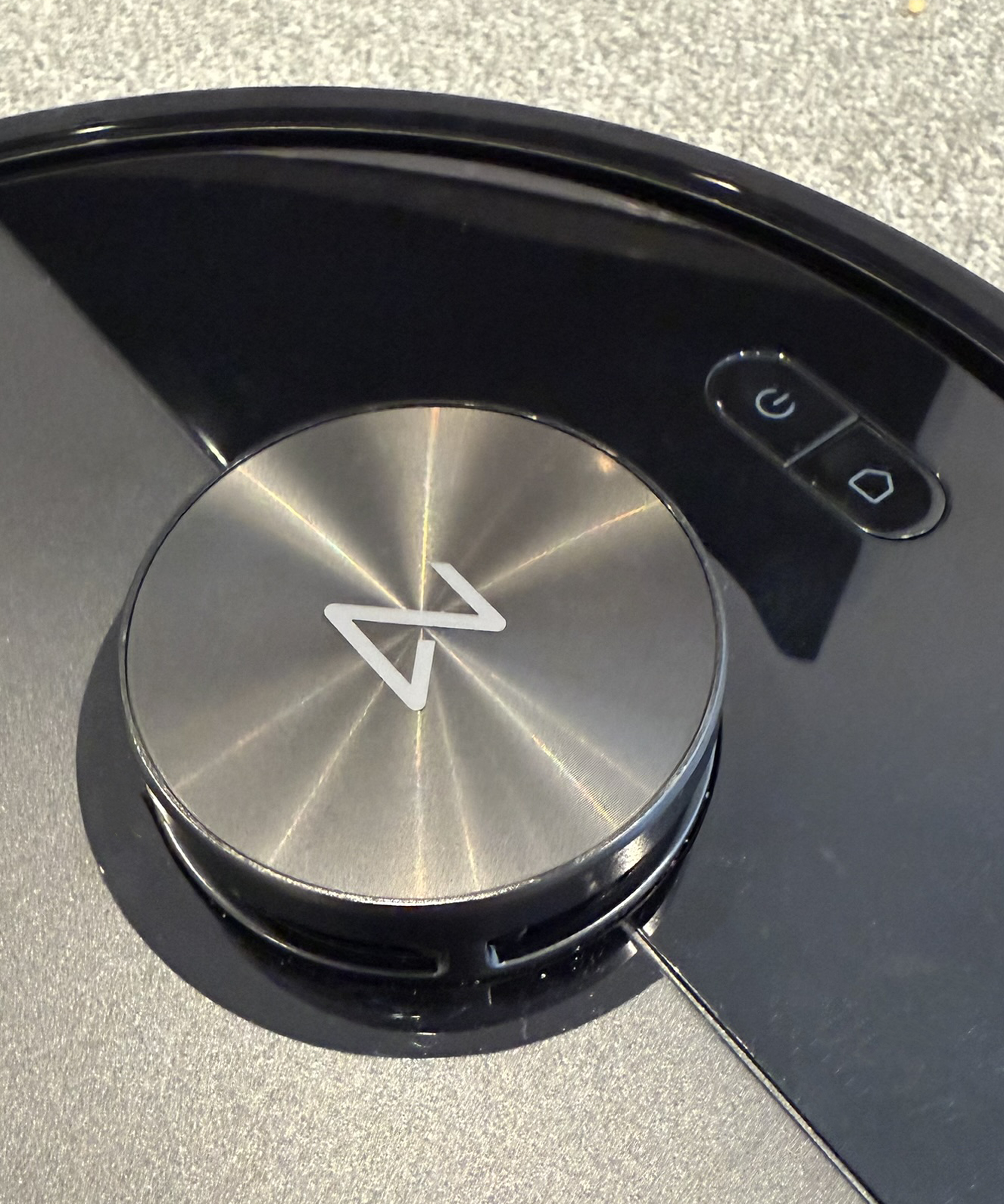 Closeup of Roborock Q7 M5 robot vacuum cleaner control buttons