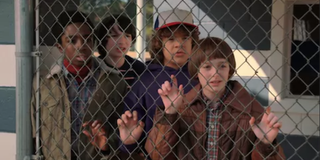 stranger things kids behind a fence