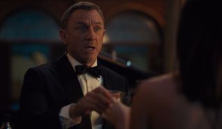No Time To Die Daniel Craig toasts in a rush