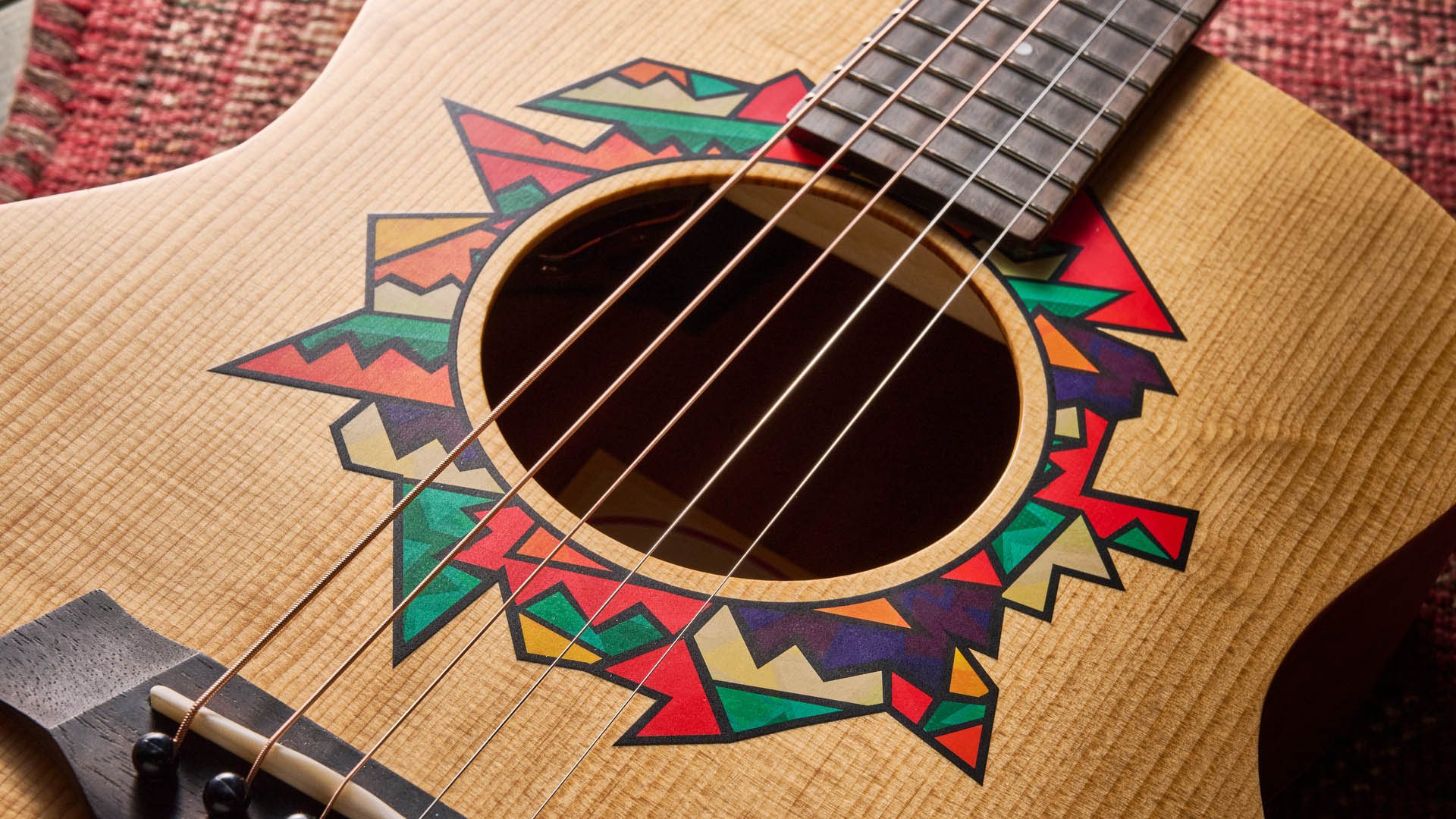 The Taylor Jacob Collier GS Mini is a compact five-string acoustic that encourages players to explore Collier's D-A-E-A-D tuning.
