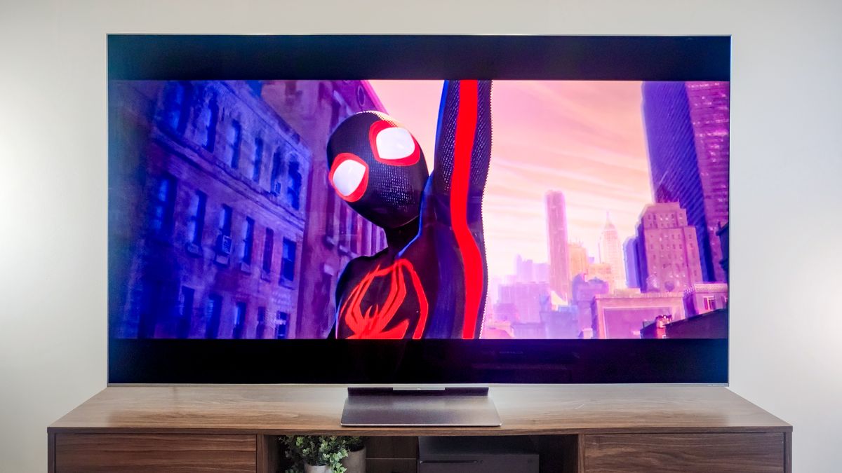 A TCL QM9K TV on a side table