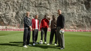 AS Monaco players standing on a pitch with B&O products 