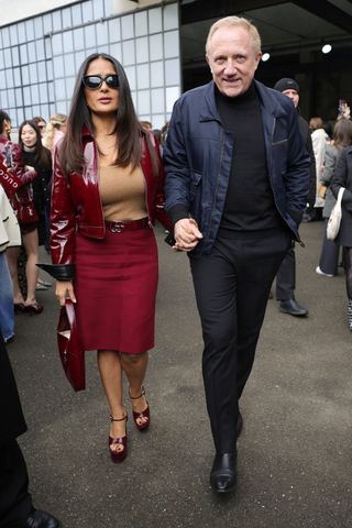 Salma Hayek Gucci show François-Henri Pinault red skirt jacket platform sandals high heels Milan Fashion Week