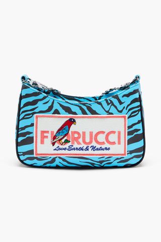 blu and black striped purse with a parrot on it