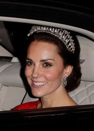 Catherine, Duchess of Cambridge arrives for the annual evening reception for members of the Diplomatic Corps at Buckingham Palace on December 8, 2016 in London, England
