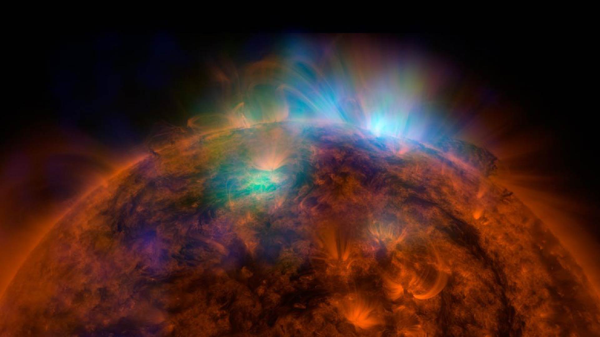 X-rays stream off the sun in this first picture of the sun, overlaid on a picture taken by NASA Solar Dynamics Observatory SDO, taken by NASA NuSTAR. The field of view covers the west limb of the sun.