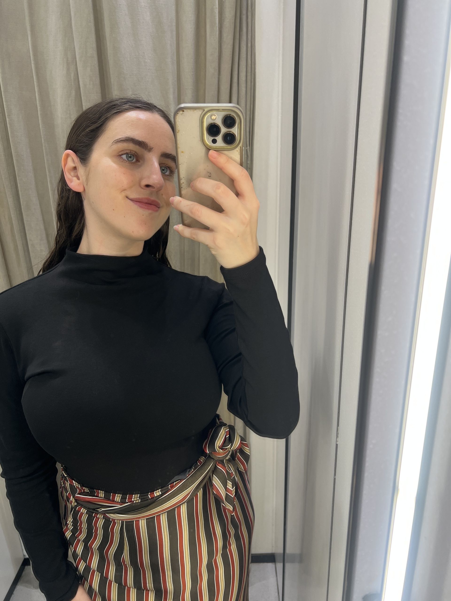 An image of Who What Wear's Ava Gilchrist wearing one of the best turtlenecks from Zara.