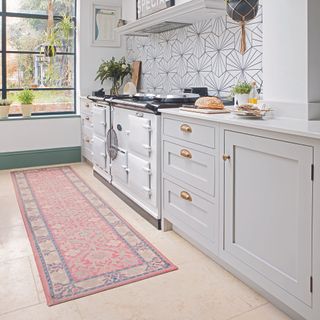 Light grey shaker kitchen with antique-inspired runner rug.