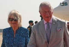 Britain's Prince Charles, the Prince of Wales, and his wife Camilla, Duchess of Cornwall, are received upon their arrival at Queen Alia International Airport