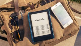 Amazon Kindle lying on a bag in the sun