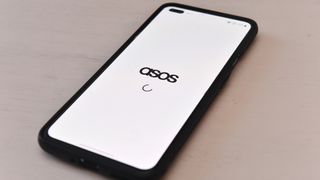 ASOS app logo pictured on a smartphone screen.