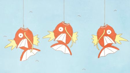 Three of the Pokemon Magikarp hang on fishing lines