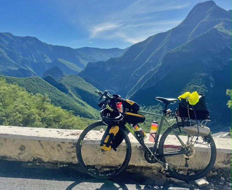 Bike with mountain and valley in the background