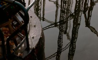 East London Hackney canal with gasworks reflected