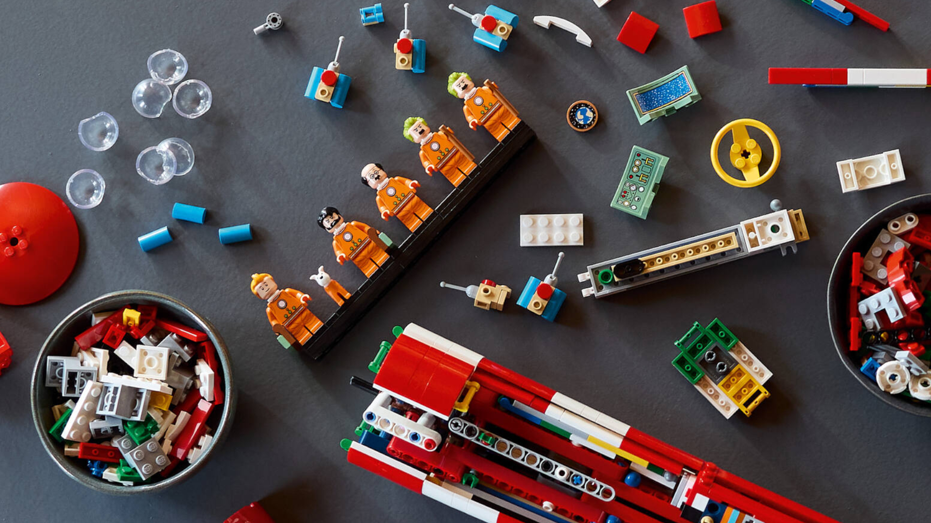 Tintin Moon Rocket in pieces on a gray surface