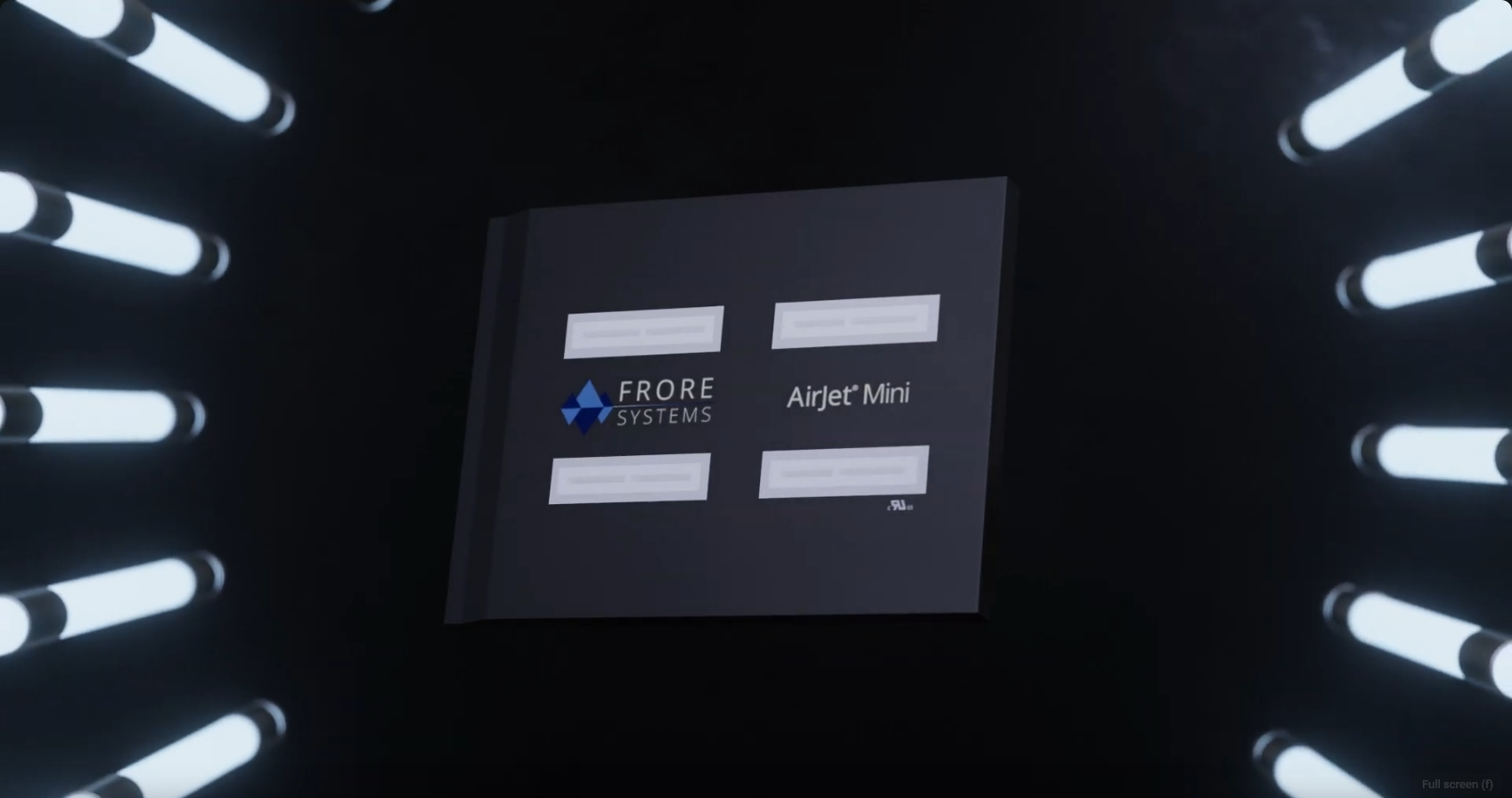 A close-up image of a cooling module labeled "AirJet Mini" from Frore Systems. The module has four rectangular components and is displayed against a dark background with symmetrical LED tube lights illuminating it from both sides.