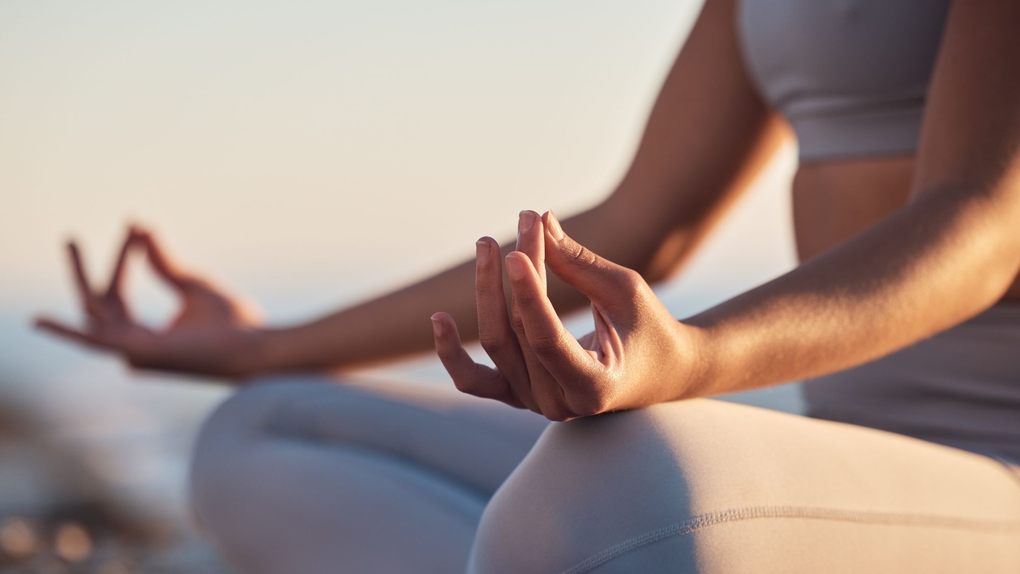 A woman sitting crossed leg doing yoga