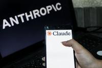 Illustration photo showing the Claude logo displayed on a smartphone and the Anthropic logo on a computer screen, highlighting the growing competition among major artificial intelligence companies and the rapid evolution of AI technologies, in Tunis,Tunisia on May 24,2026. (Photo by Imen Ben Youssef / Hans Lucas via AFP)