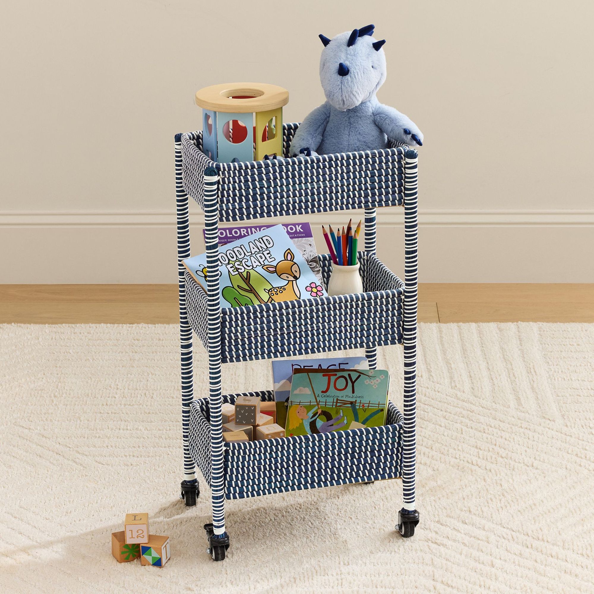 Rolling storage cart in blue and white with three tiers