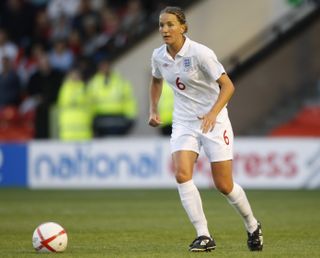 Casey Stoney playing for England