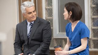 Rick Hearst and Rebecca Herbst as Ric and Elizabeth talking in General Hospital