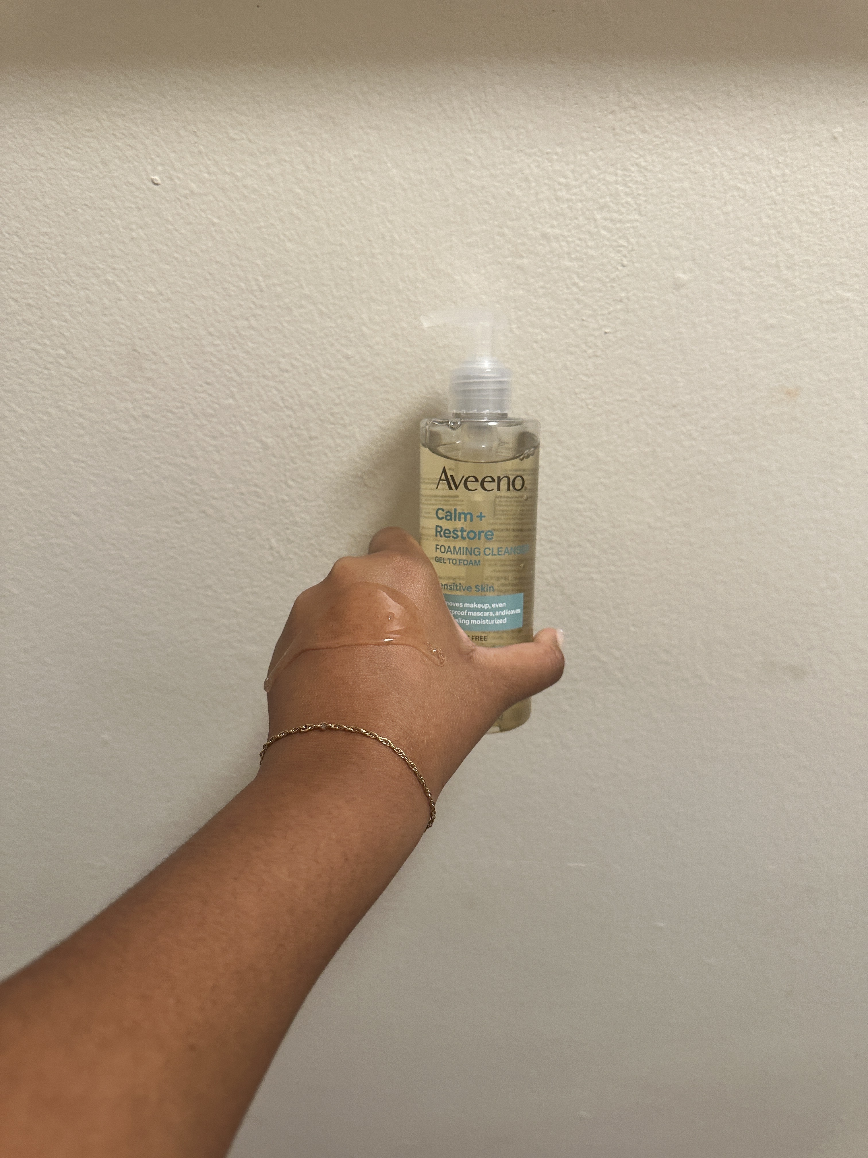 Ariel Baker testing the Aveeno Calm + Restore Nourishing Oat Facial Cleanser.