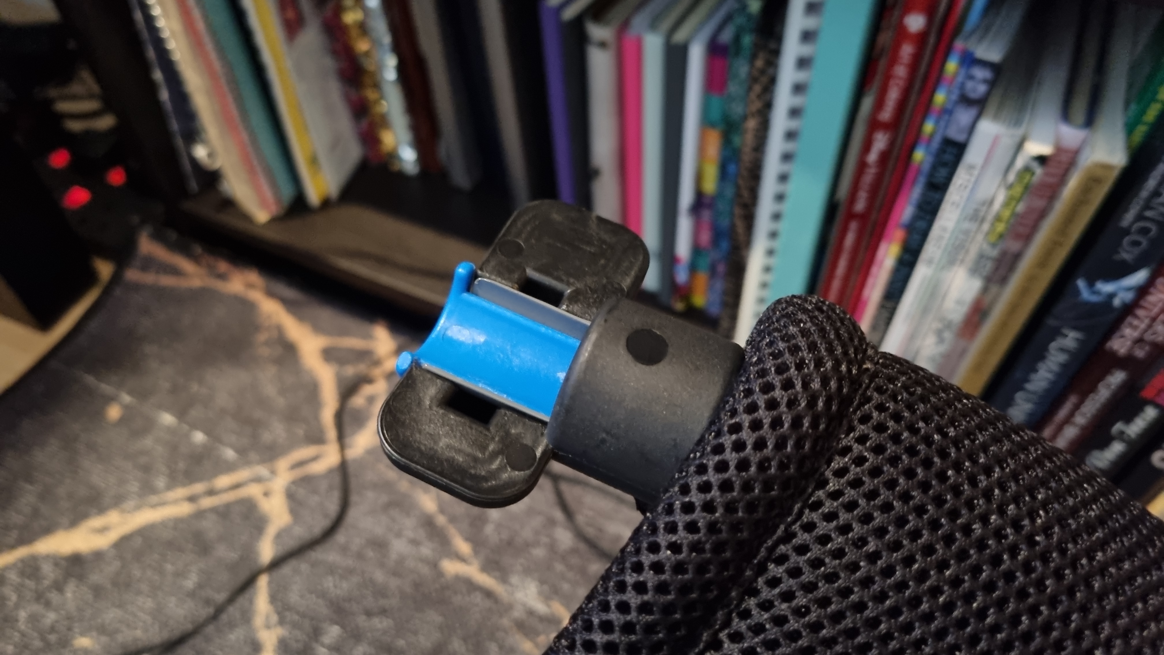 The lock that keeps the wheelbase secure on the Logitech Playseat Challenge X