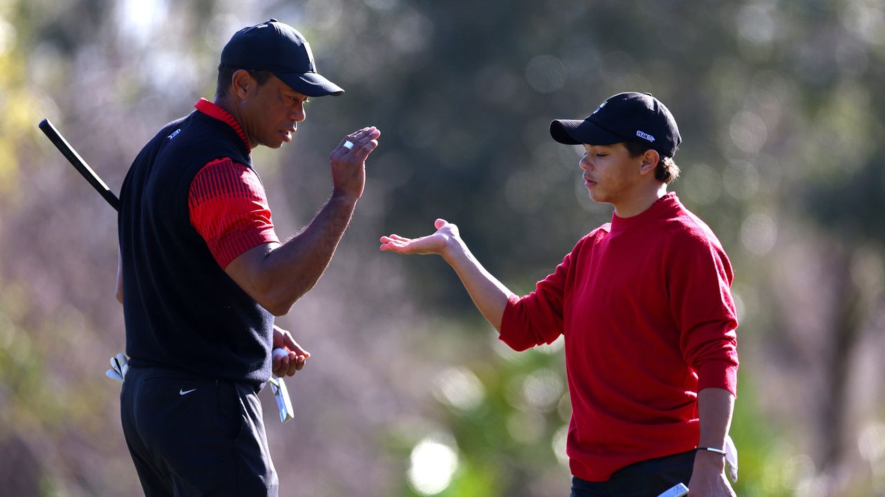 Tiger Woods and his son Charlie share a high five at the 2023 PNC Championship