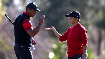 Tiger Woods and his son Charlie share a high five at the 2023 PNC Championship