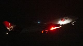 Virgin Orbit's Cosmic Girl Boeing 747 lifting off with Launcher One underneath its wing is taking off for the Start Me Up mission from Spaceport Cornwall in the U.K.