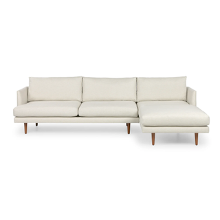 linear white sectional sofa on legs