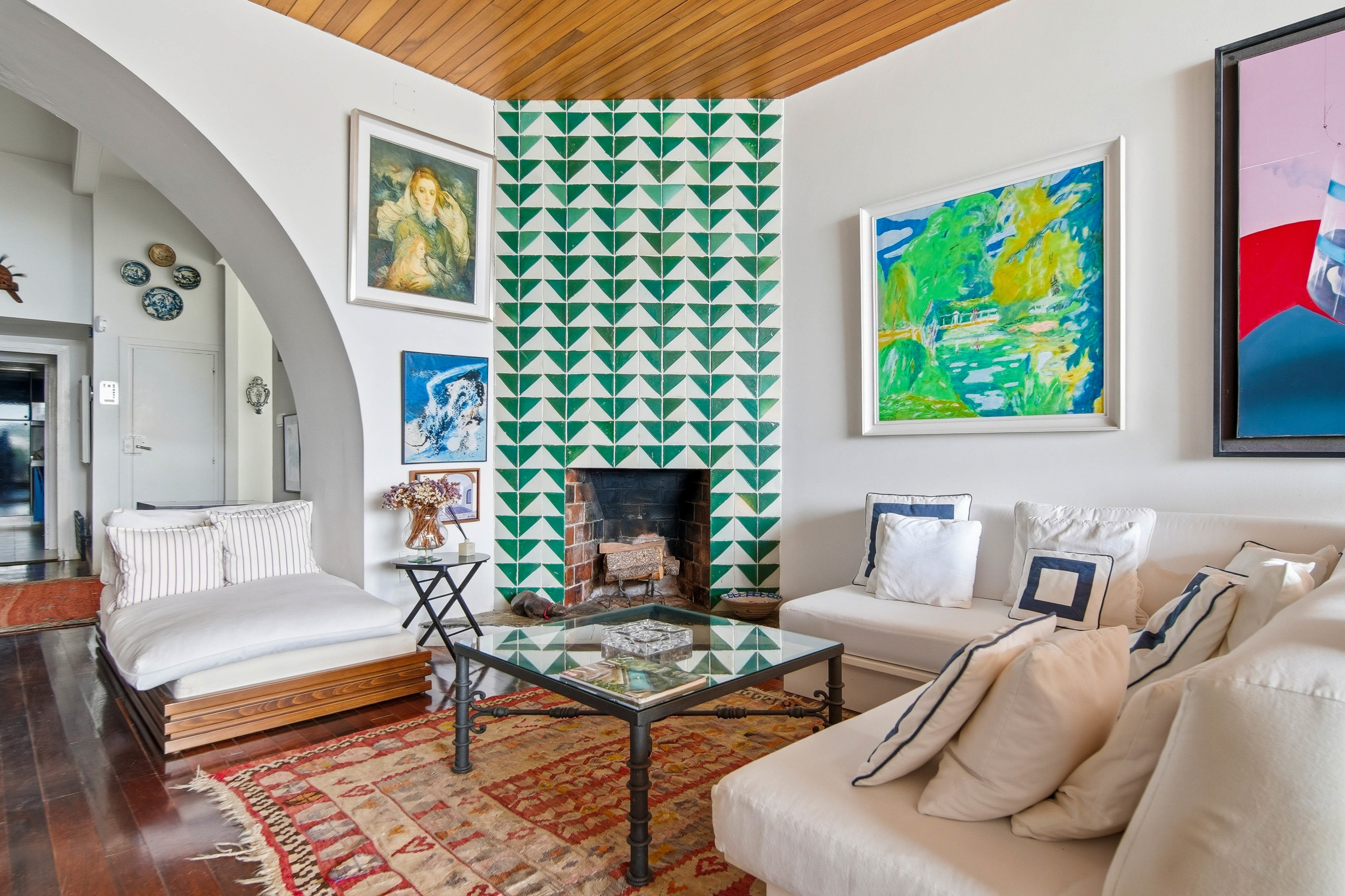 Traditional tiles are combined with built-in furniture and plenty of space for art